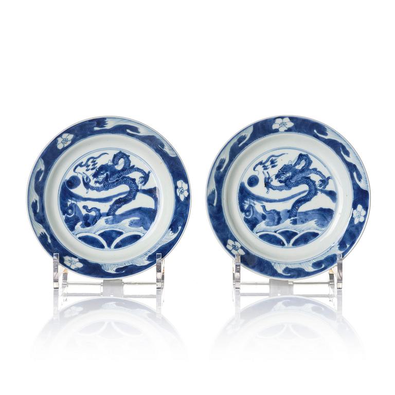 A pair of blue and white 'dragon and fish dishes', Qing dynasty, Kangxi (1662-1722).