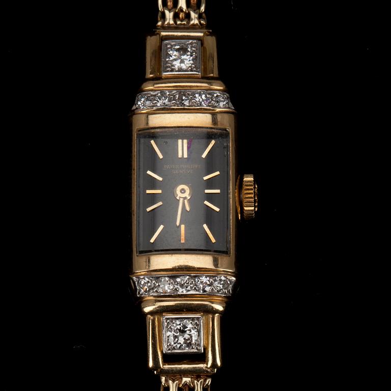 DAMARMBANDSUR, 18k guld samt briljantslipade diamanter tot. ca 0,38 ct. Patek Philippe, Genève.