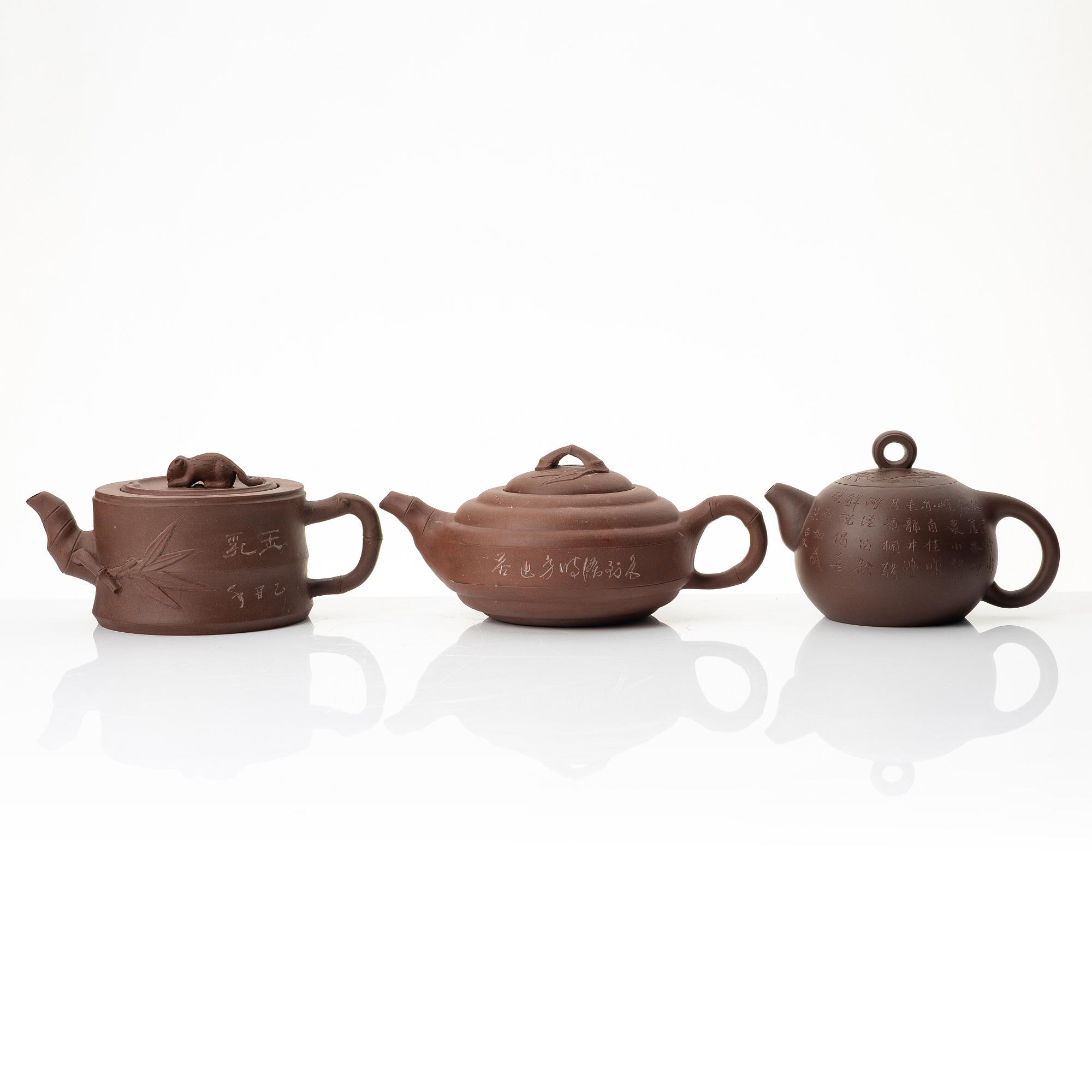 A group of three Chinese yixing teapots, 1960-80s.