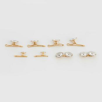 A pair of cufflinks, two shirt studs and four vest buttons in 18K gold and platinum set with mother-of-pearl and pearls.