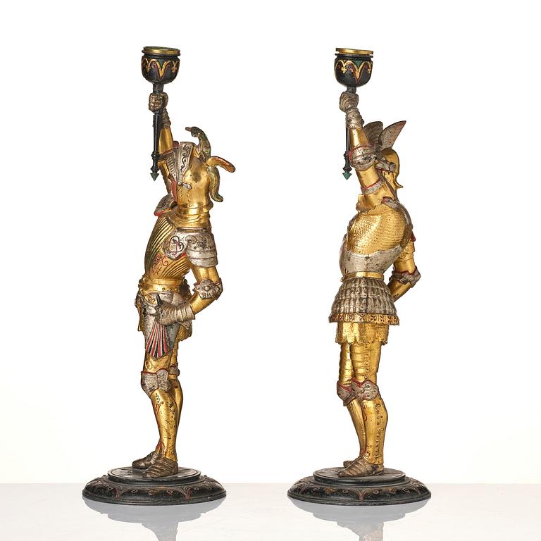 A pair of presumably German knights candlesticks, secound half 19th century.