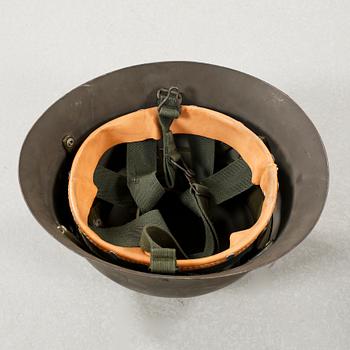 Five military helmets and a hat, late 19th and 20th century.