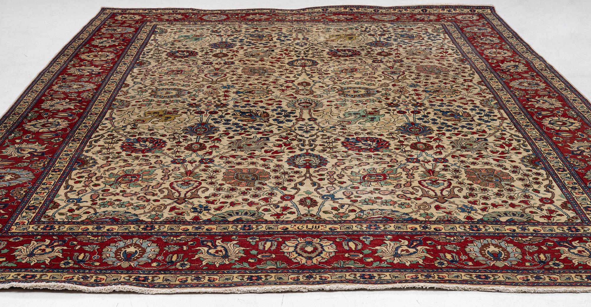A Tabriz carpet, c. 385 x 287 cm.