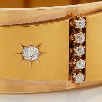 An 18K gold bracelet set with old-cut diamonds.