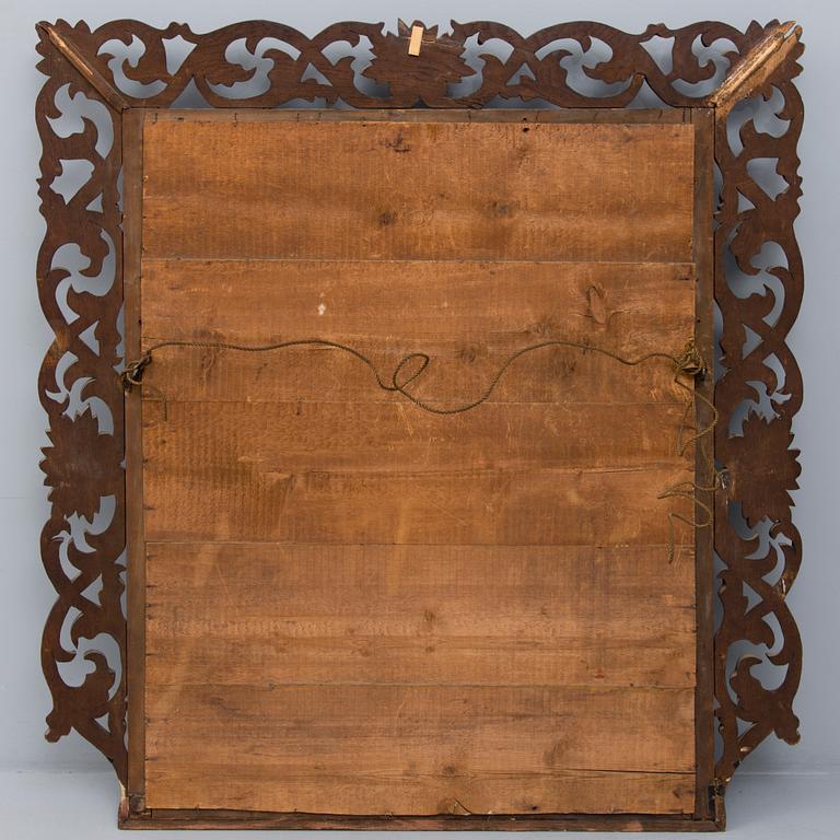 A BAROQUE MIRROR, late 19th century.