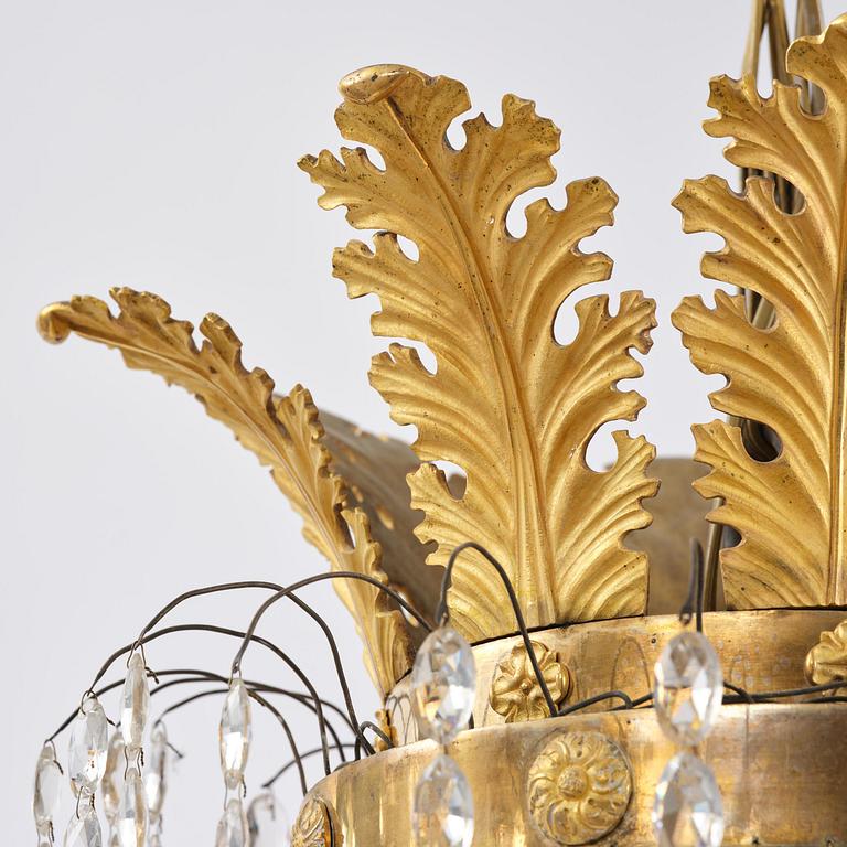 An ormolu and cut glass sixteen-branch Empire chandelier, Paris, early 19th century.