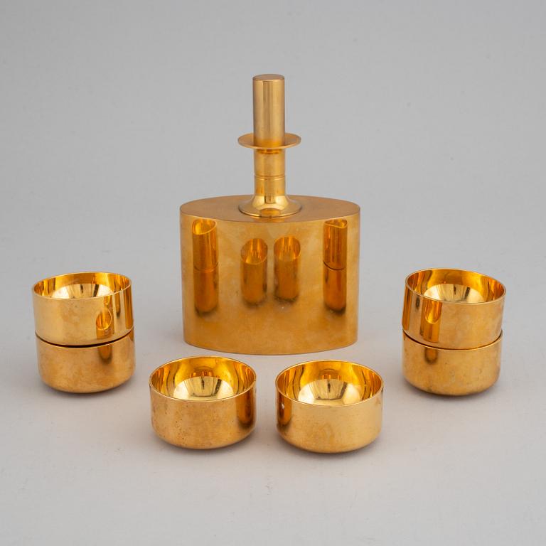 PIERRE FORSSELL, a gilt brass flask and six cups, Skultuna.