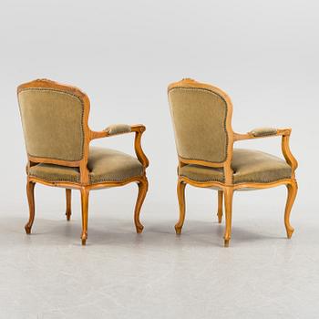 A pair of mid 20th century rococo style armchairs.