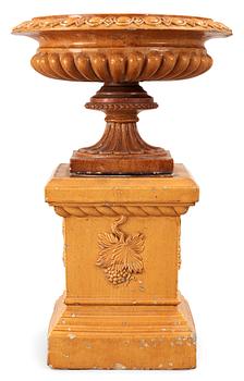622. A Scottisch late 19th century yellow glazed stoneware garden urn and base by J&M Craig.