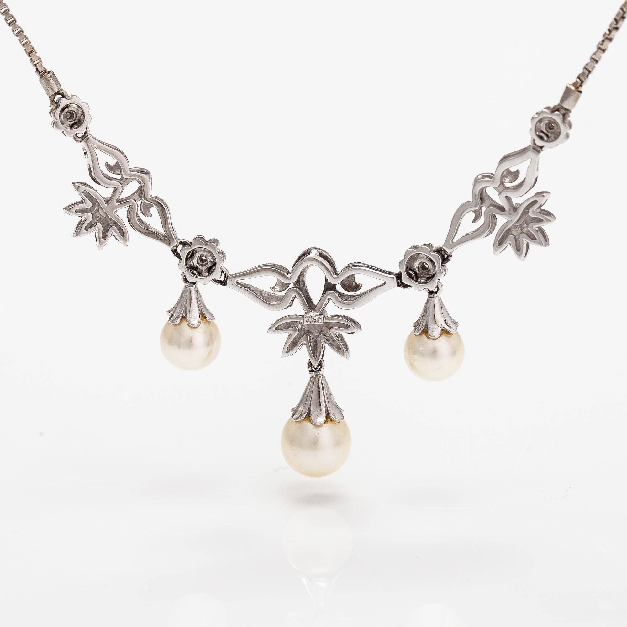 An 18K white gold necklace with cultured pearls and diamonds ca. 0.04 ct in total. Finnis import marks 1963.