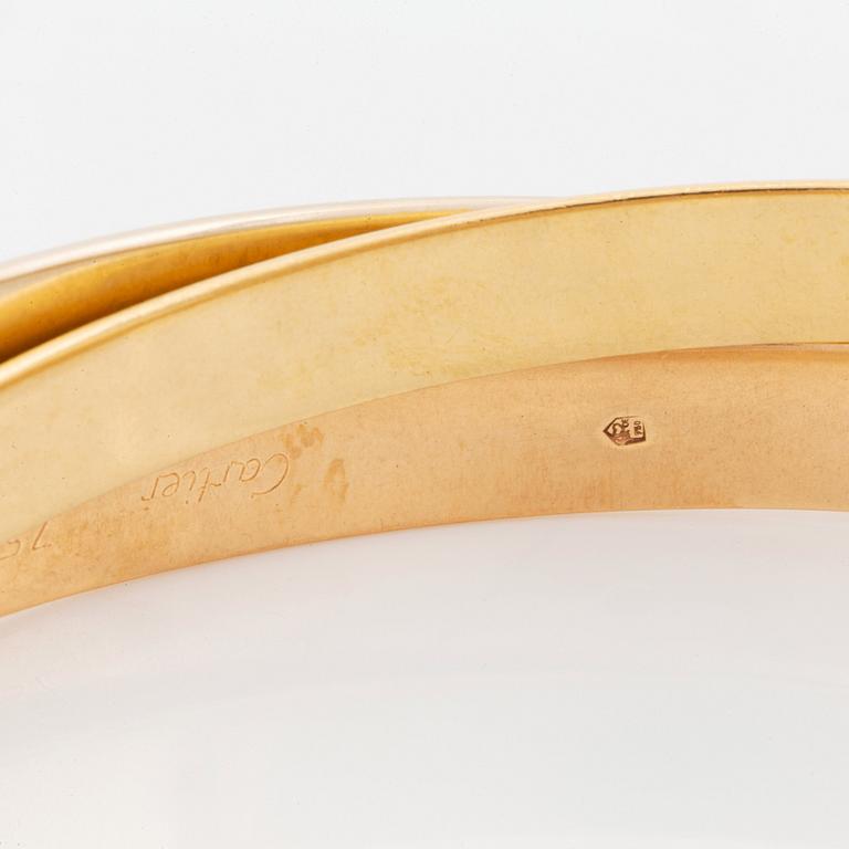 A Cartier "Trinity" bracelet in 18K gold.