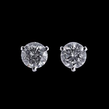 1070. A pair of brilliant cut diamond ear studs, each app. 0.75 cts.