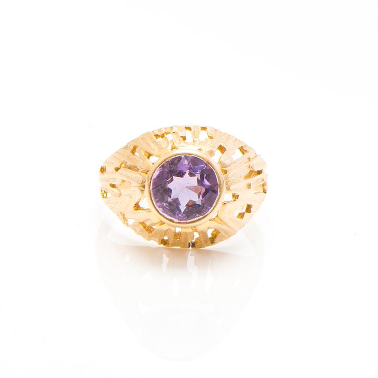 A set of 14K gold earrings and a ring with amethysts.