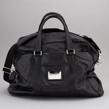 DOLCE & GABBANA, a black leather weekend bag, 2009.