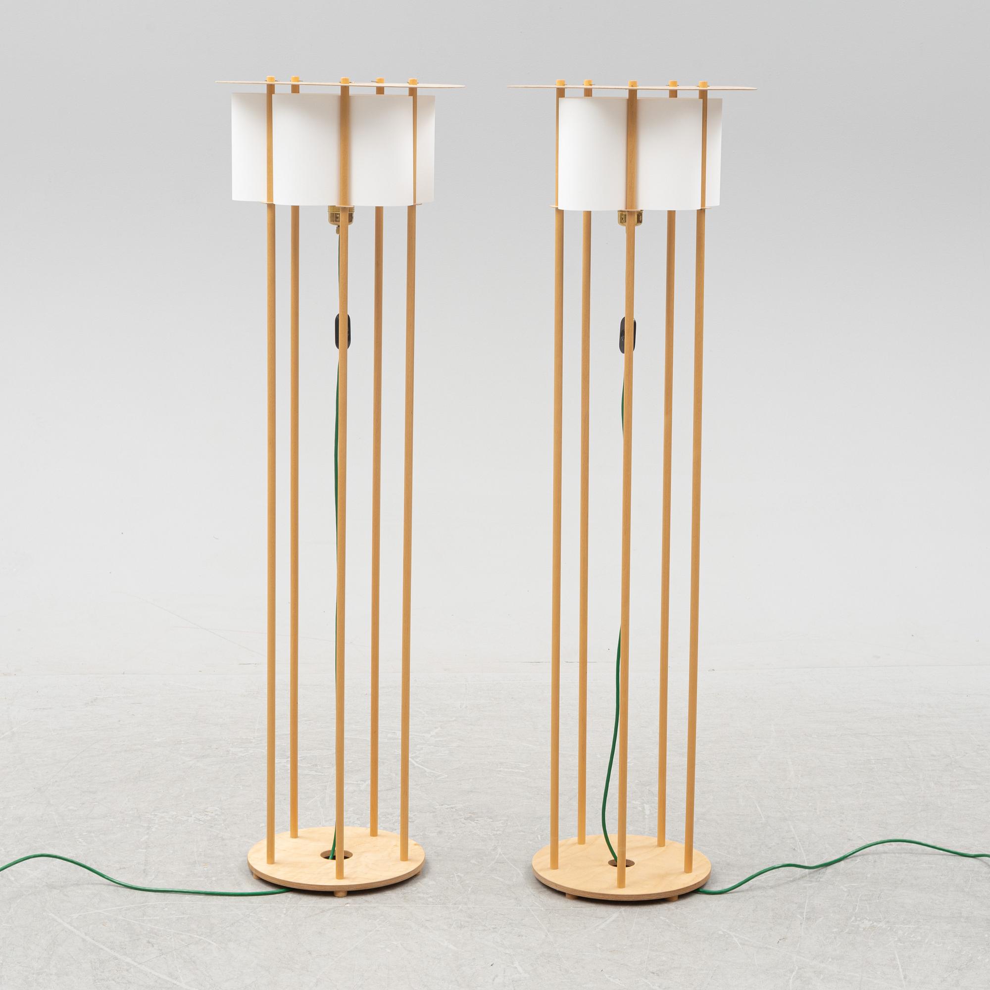 Torbjörn Ahlström, a pair of birch floor lights, dated 1993.