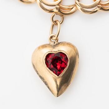 Armband 18K guld bismarcklänk, med berlocker.