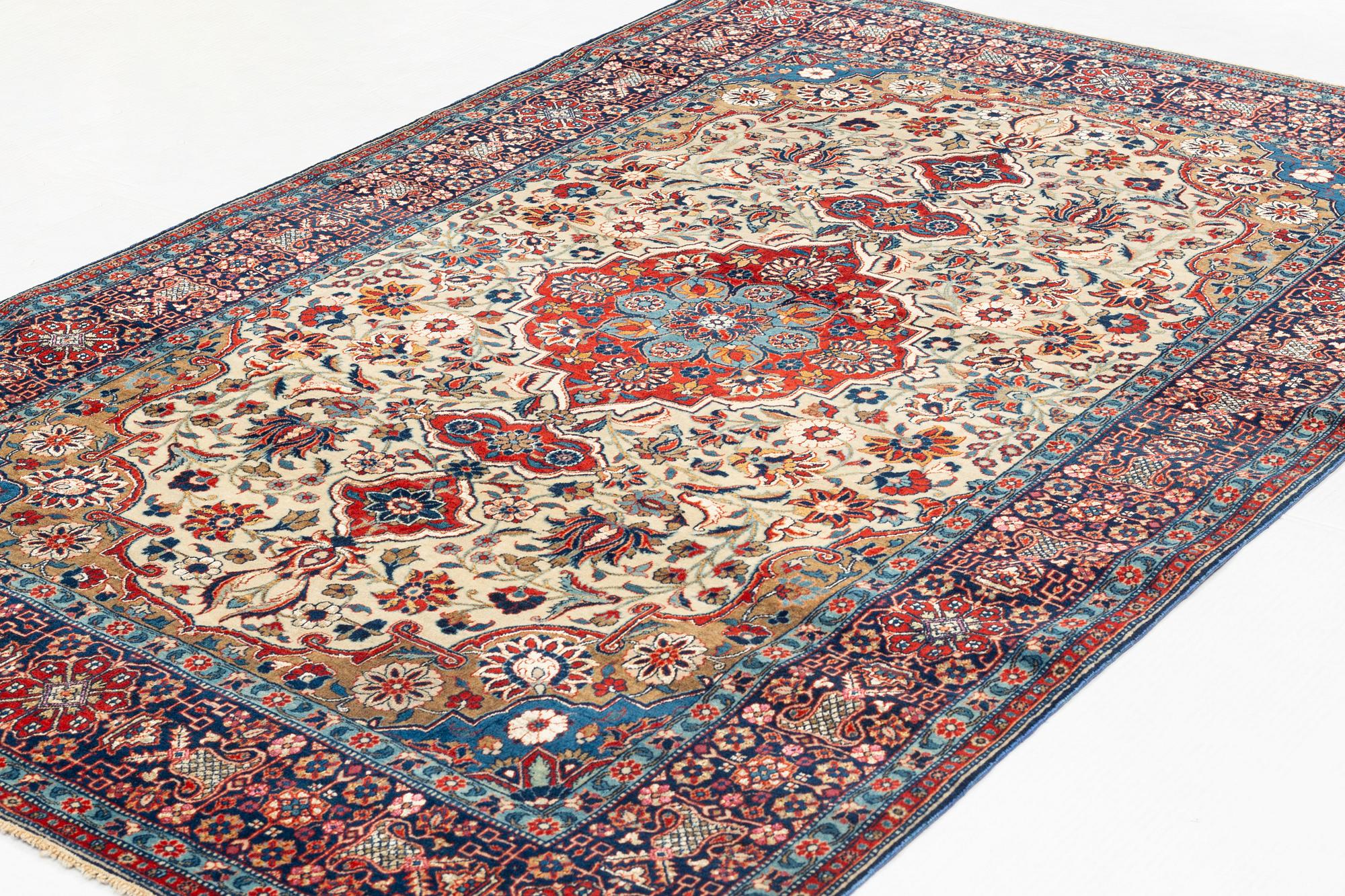 A rug, semi-antique, Teheran, part silk, 204 x 132 cm.