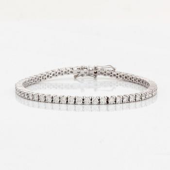 Brilliant-cut diamond tennis bracelet, with report HRD.