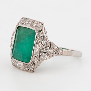 An art déco emerald and diamond ring.