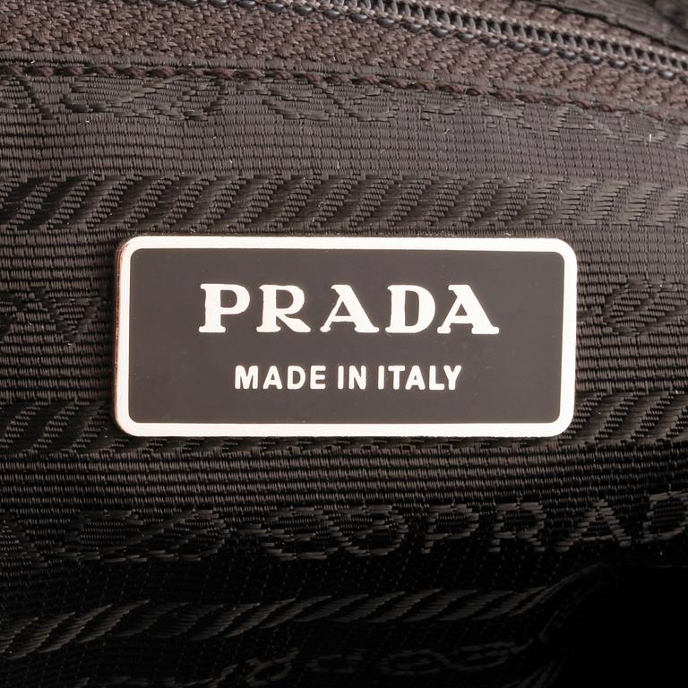 PRADA, a brown nylon crossbody bag.