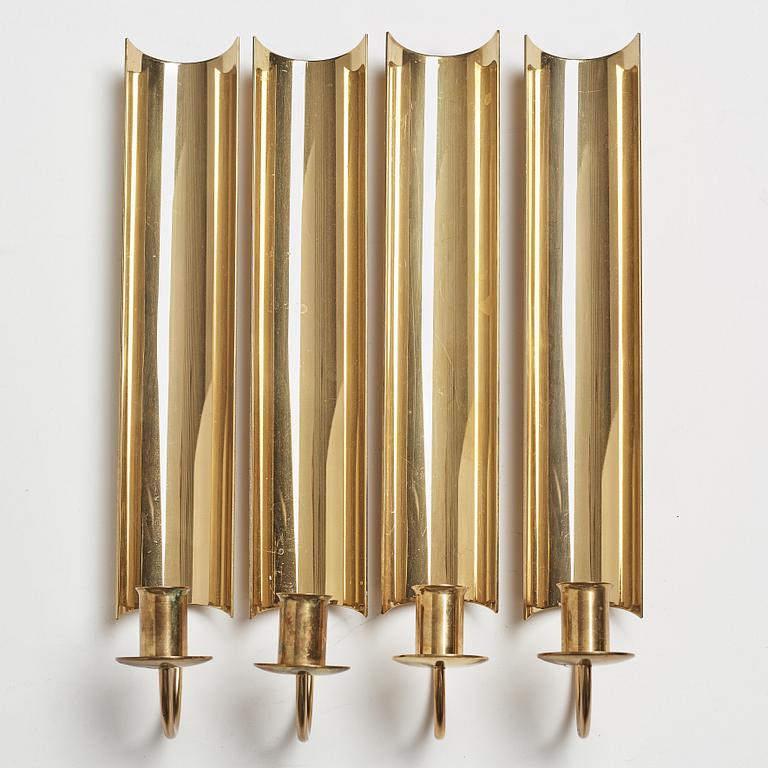 A set of four 'Reflex' brass wall scones by Pierre Forsell, Skultuna.