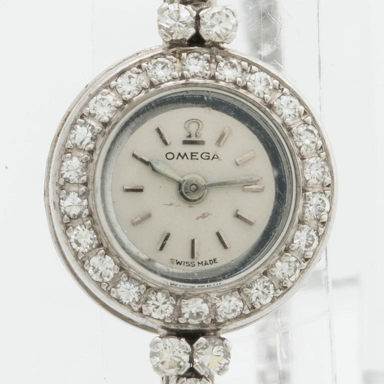 OMEGA smyckeur, 15 mm, 18k vitguld m briljanter ca 0,40 ct totalt, armband G Dahlgren & Co, Malmö 1957, originaletui.