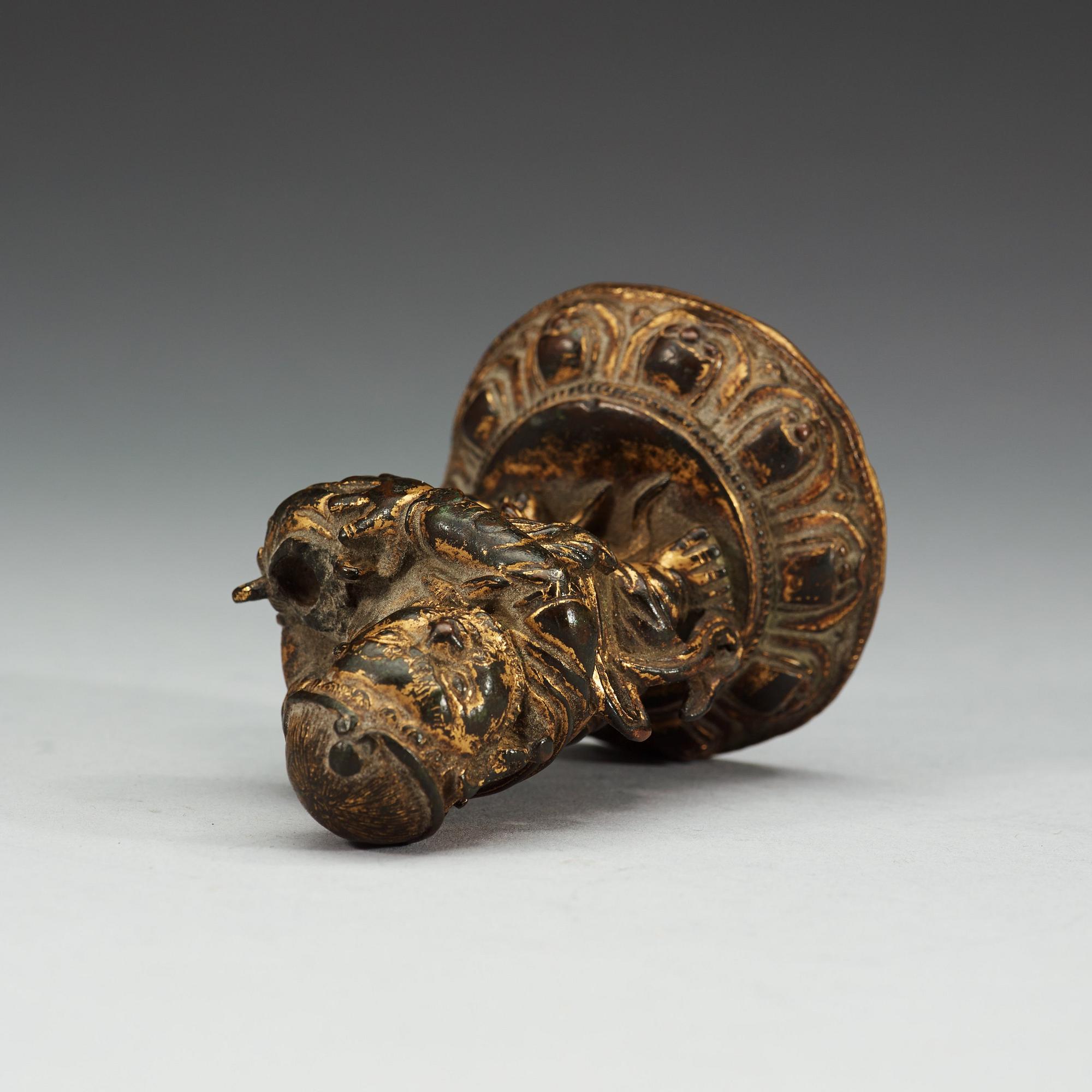 A gilt bronze figure of a guardsman, Qing dynasty (1644-1912).