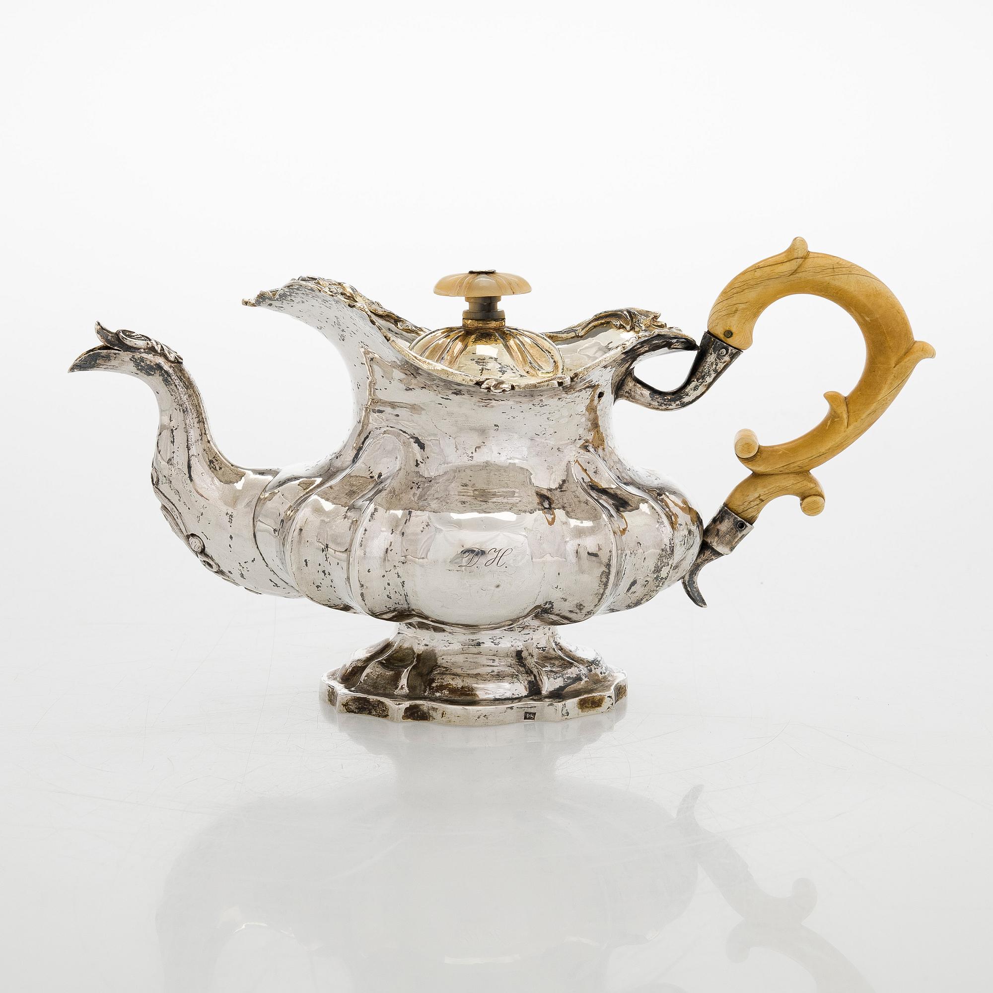 A parcel-gilt silver teapot, Moscow 1845.