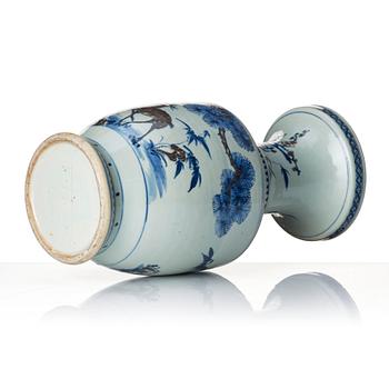 A blue and white and iron red vase. Qing dynasty, 19th century.