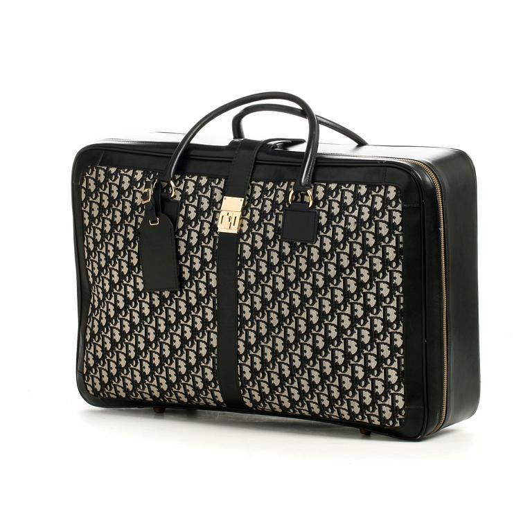 CHRISTIAN DIOR, a monogram canvas suitcase.