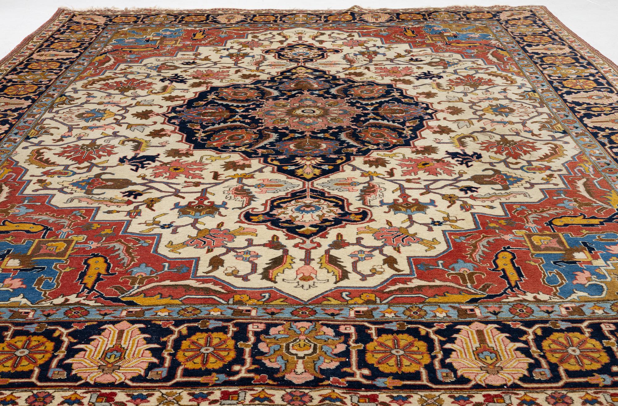 An antique Tabriz carpet, c. 365 x 280 cm.