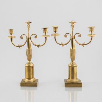 A pair of brass candelabra, first half/mid 19th century.
