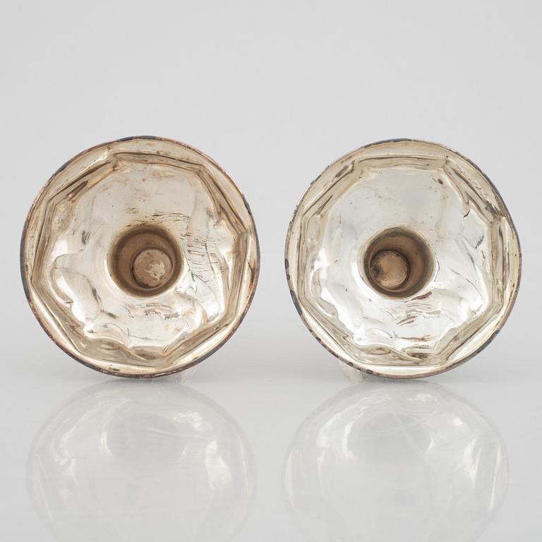 A pair of Chinese silver plated copper candle sticks, 20th century.