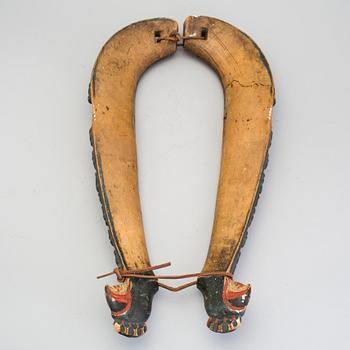 A pair of carved and painted folk art horse hames 18/19th century.