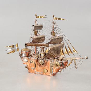 A boat sculpture, dated -75.