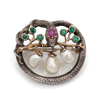 A Karl Rothmüller, Art Nouveau serpent brooch, circa 1900, with a ruby, emeralds and probably natural saltwater pearls.