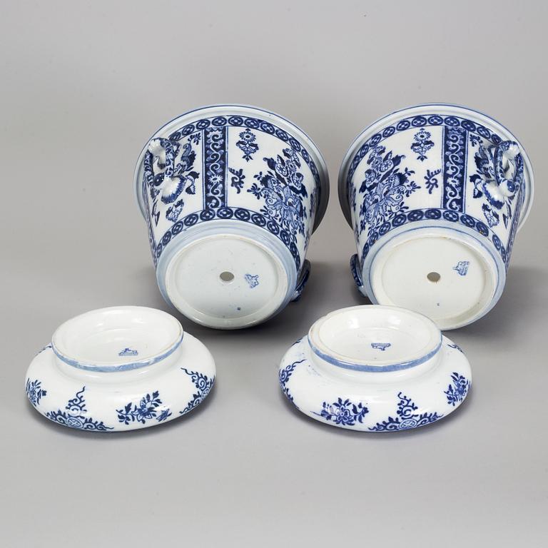 A pair of Petrus Regout & Co, Maastricht pots with bases, Delft, 20th century.