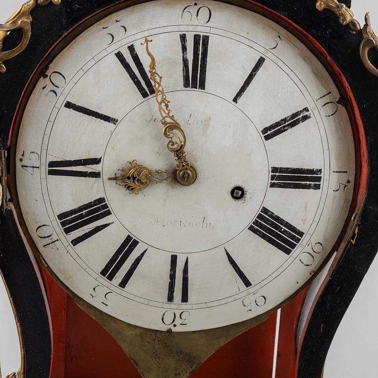 Clock, Rococo style with partially older parts, around the year 1900.