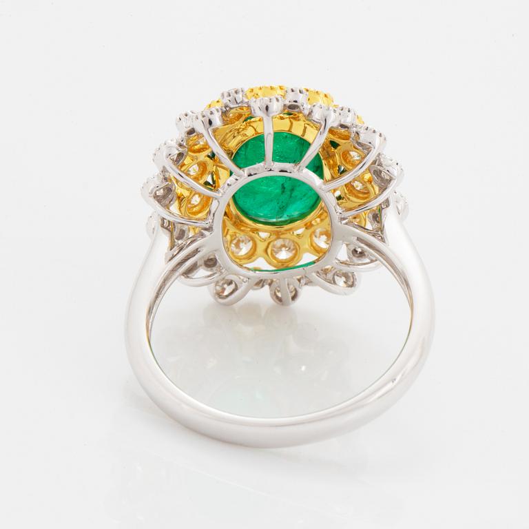 Cabochon-cut emerald and brilliant-cut diamond ring.