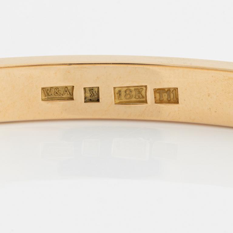 18K gold and brilliant cut diamond bangle.