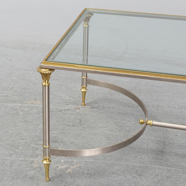 A 1970s sofa table, brass and glass.
