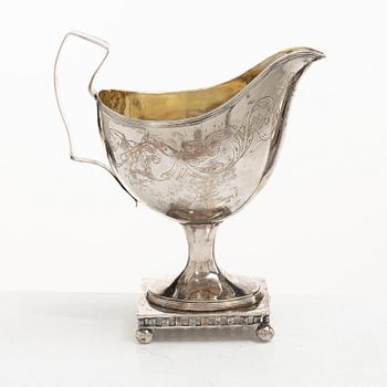 A Swedish Gustavian parcel-gilt silver sauce jug, mark of Daniel Hallman, Stockholm 1810.