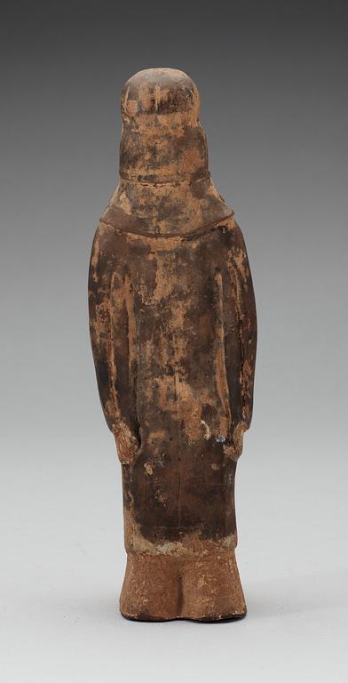 A painted pottery figure of a standing female, Tang dynasty (618-907).