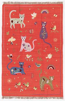 A hand-embroidered Kilim rug, c. 182 x 122 cm.