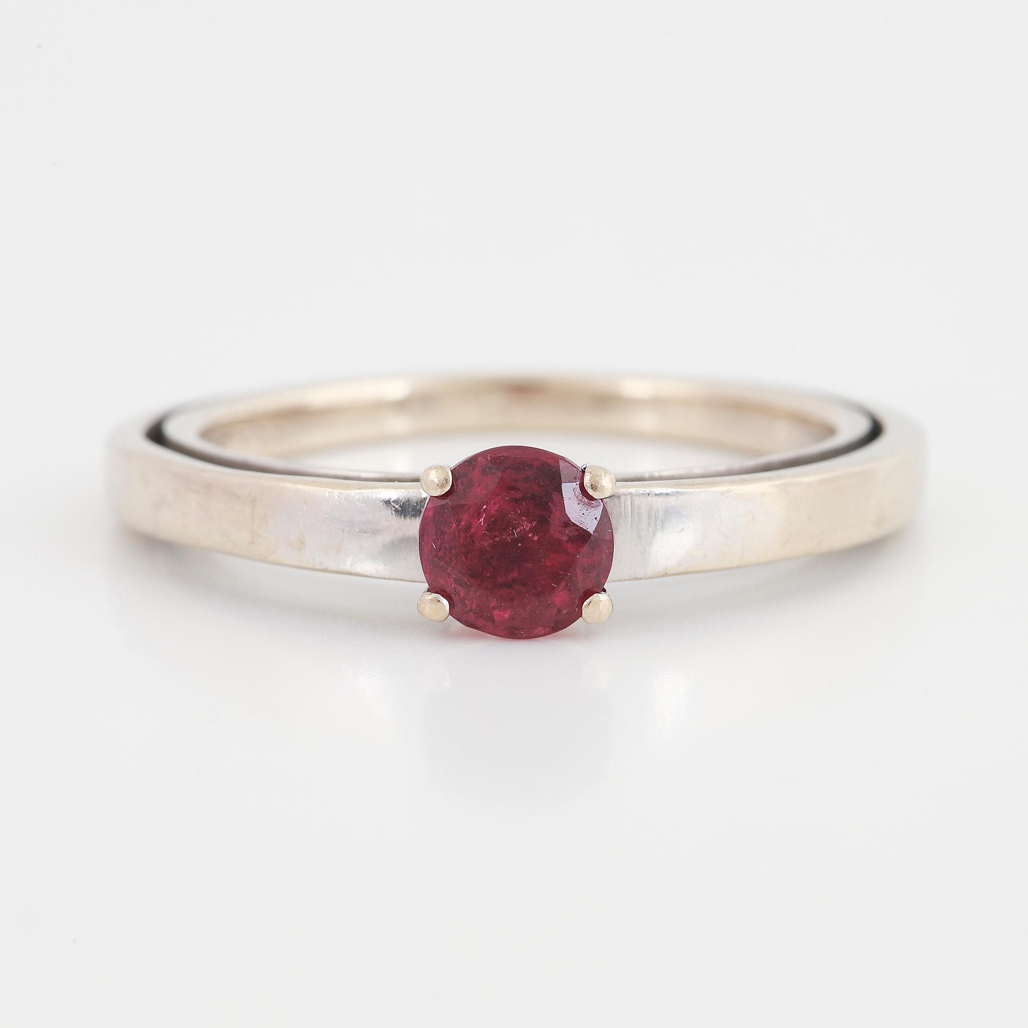 A tourmaline and brilliant cut diamond ring.