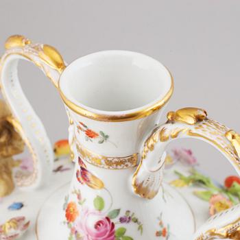 A pair of enamelled earthenware vases with covers, 20th century.