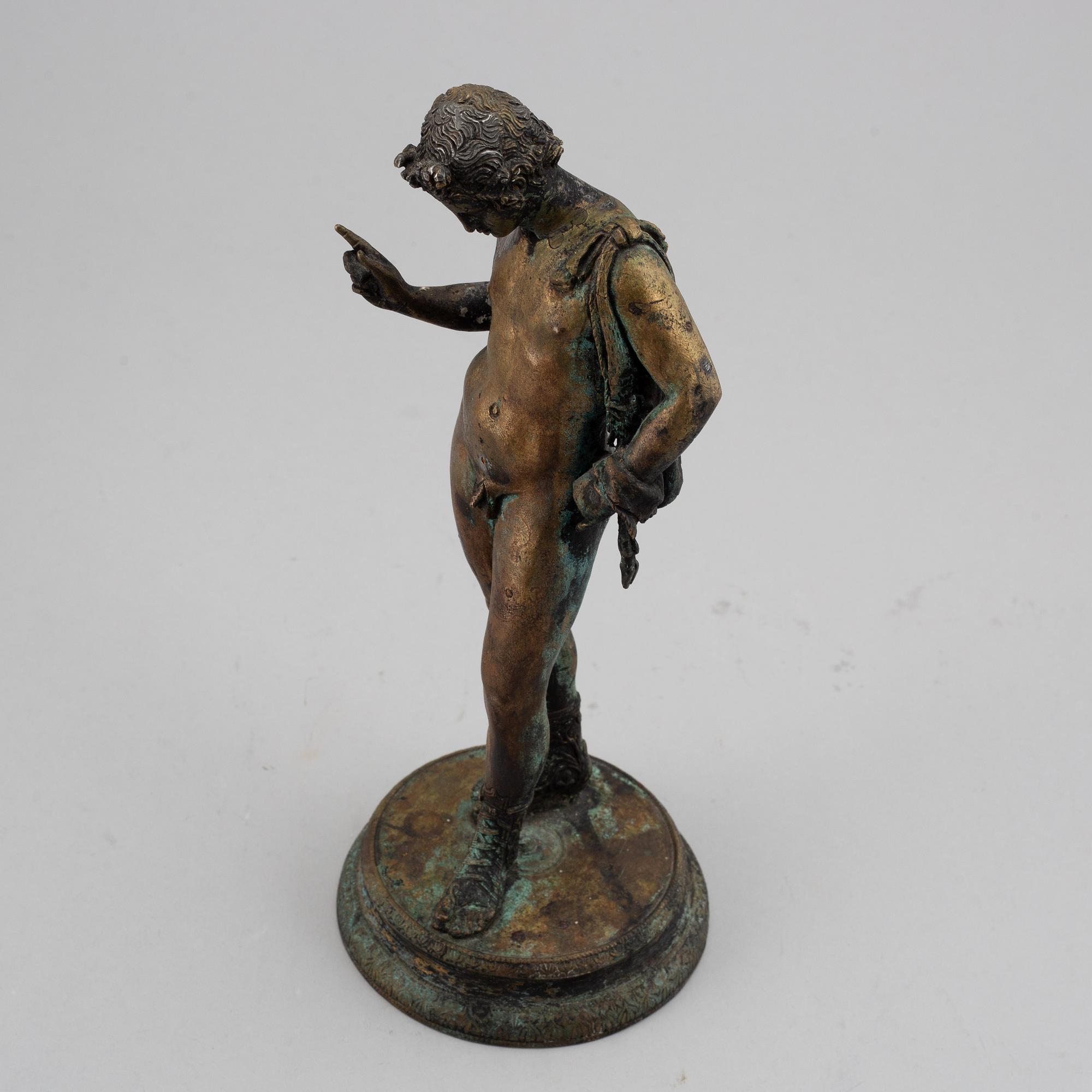 A 20th century bronze sculpture of Narcissus.