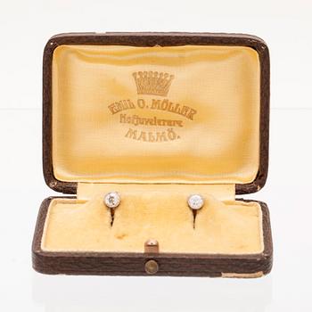 A pair of 18K white and red gold shirt buttons set with round old cut diamonds by Emil O. Möller Malmö 1942.