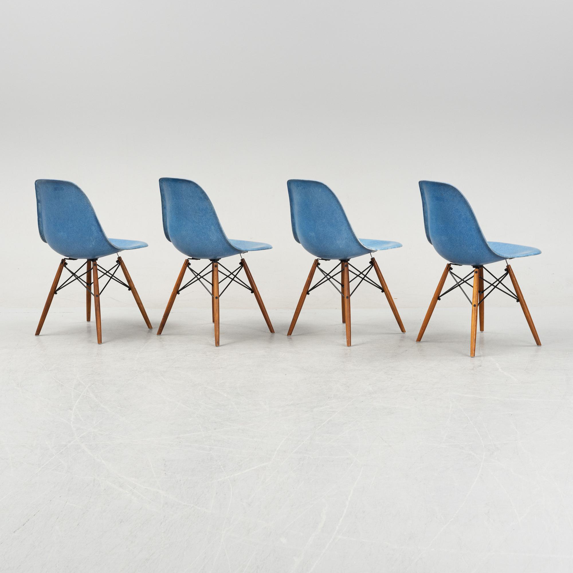 A set of four Charles and Ray Eames 'Plastic Chair DSW' with later stands, designed 1950.