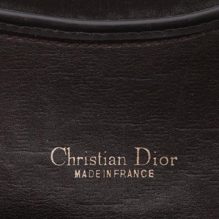CHRISTIAN DIOR, a brown monogram canvas clutch bag.